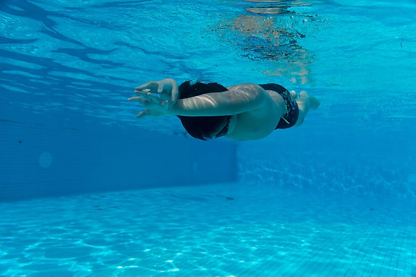 Happy young asian kid with swim goggles