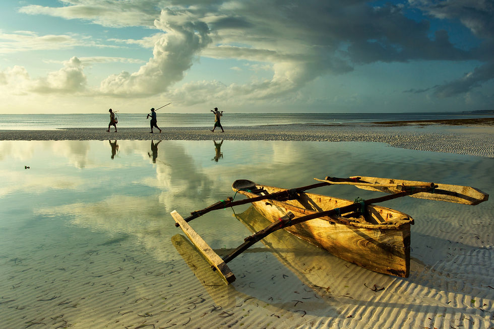 A tradition boat on the beach in shallow water used by locals in Zanzibar