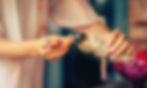 Woman using a match to light a bundle of sage for smudging