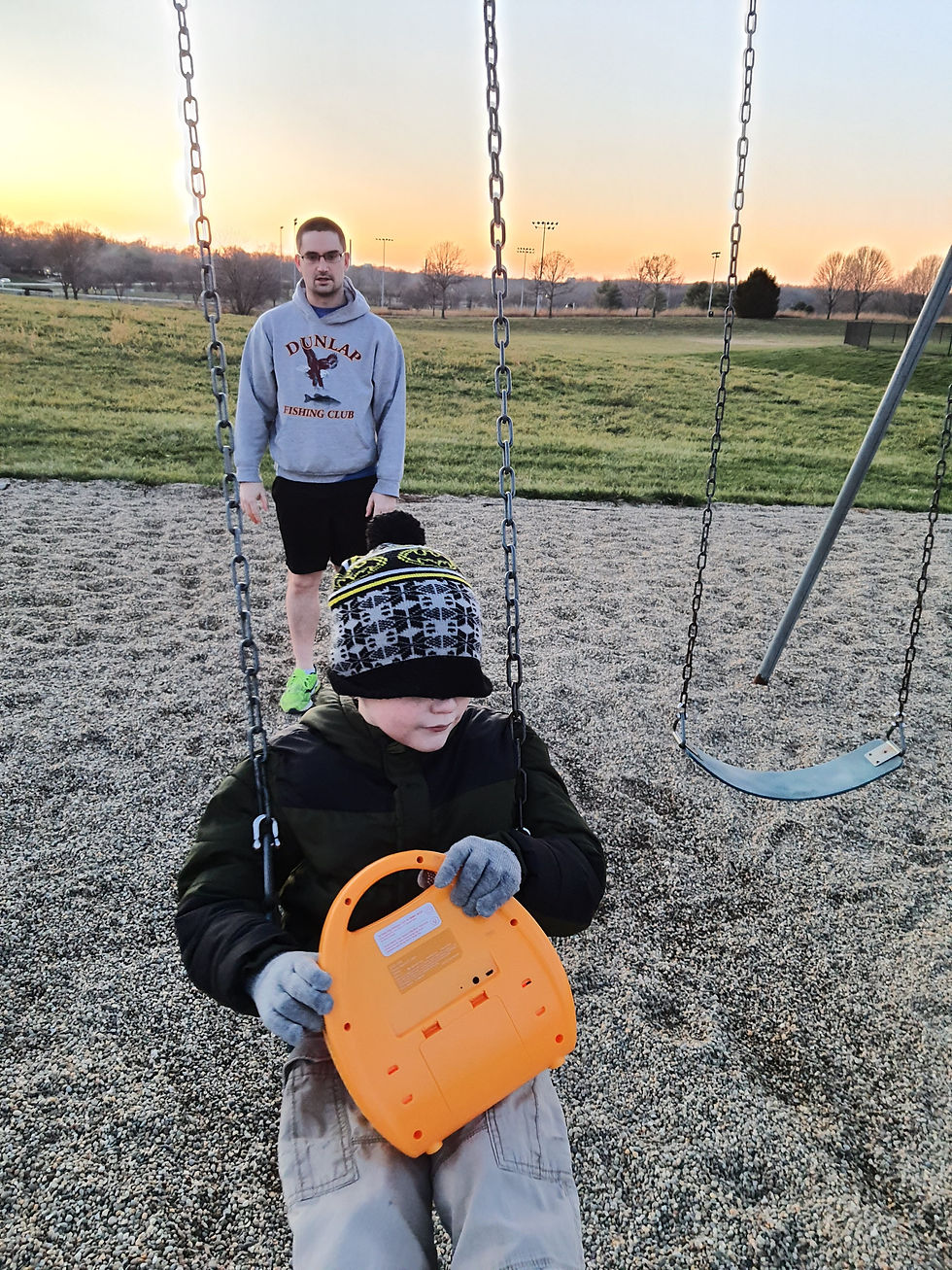 Cubadie-Patoobadie and Matt sharing a moment on a swing, representing the playful, relationship-first engagement we champion at Something to Say ABA.
