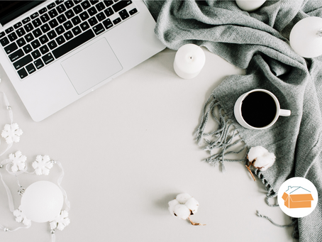 Laptop with coffee and a blanket