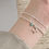 Thumbnail: Elegant Silver Strand Bracelet with Doggie Charm