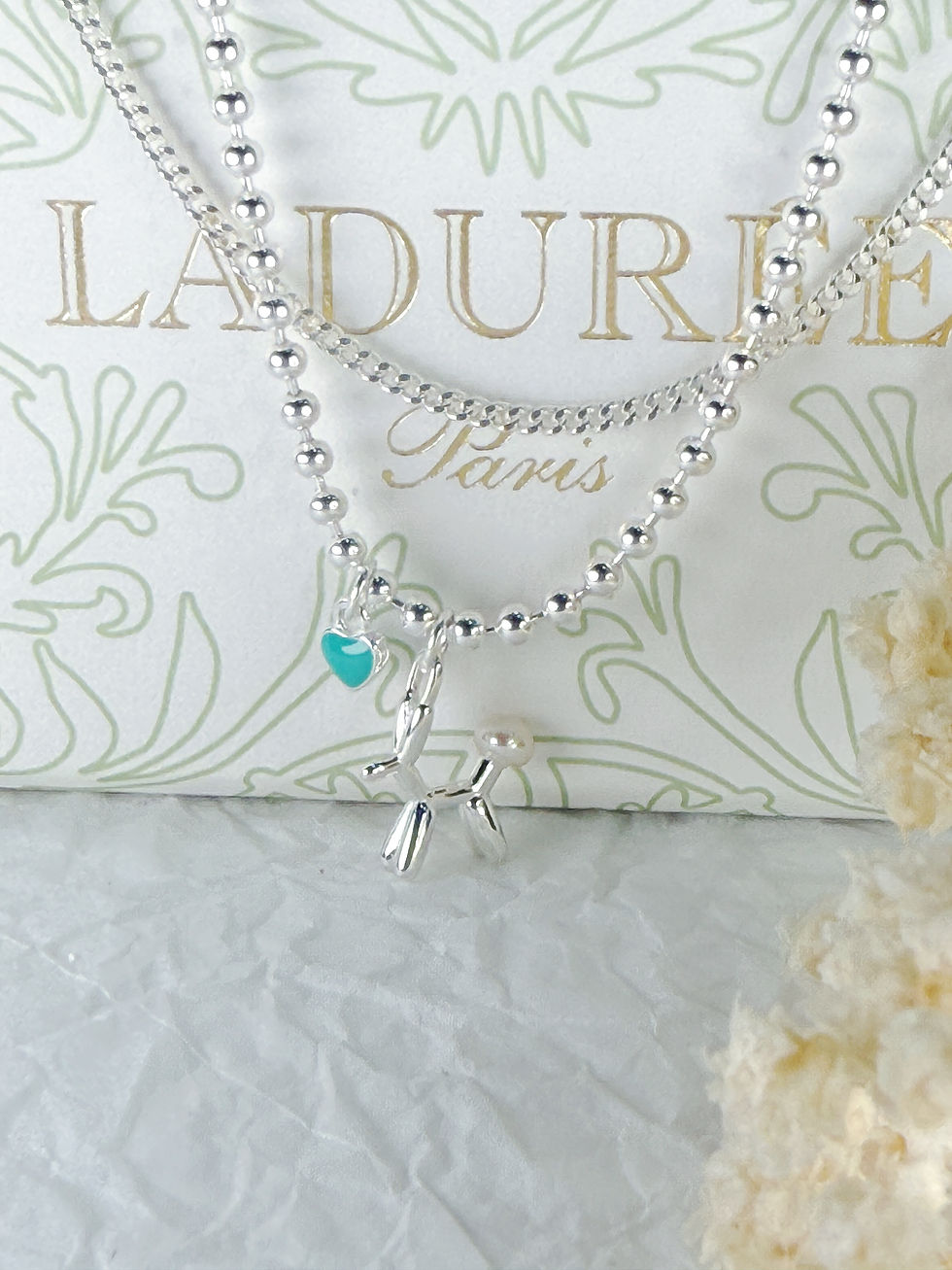 Thumbnail: Elegant Silver Strand Bracelet with Doggie Charm