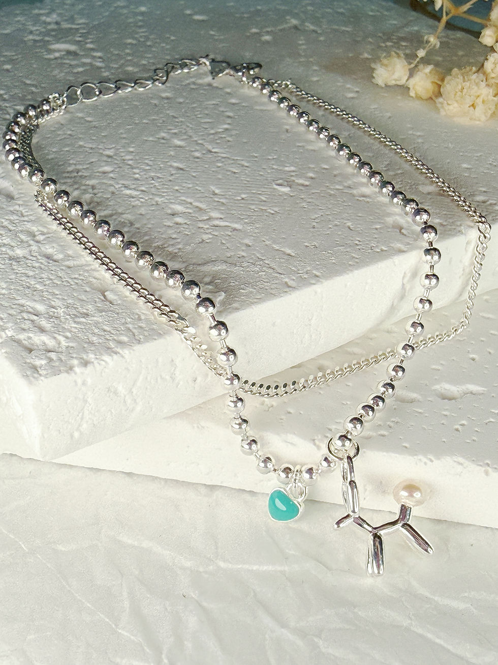 Thumbnail: Elegant Silver Strand Bracelet with Doggie Charm
