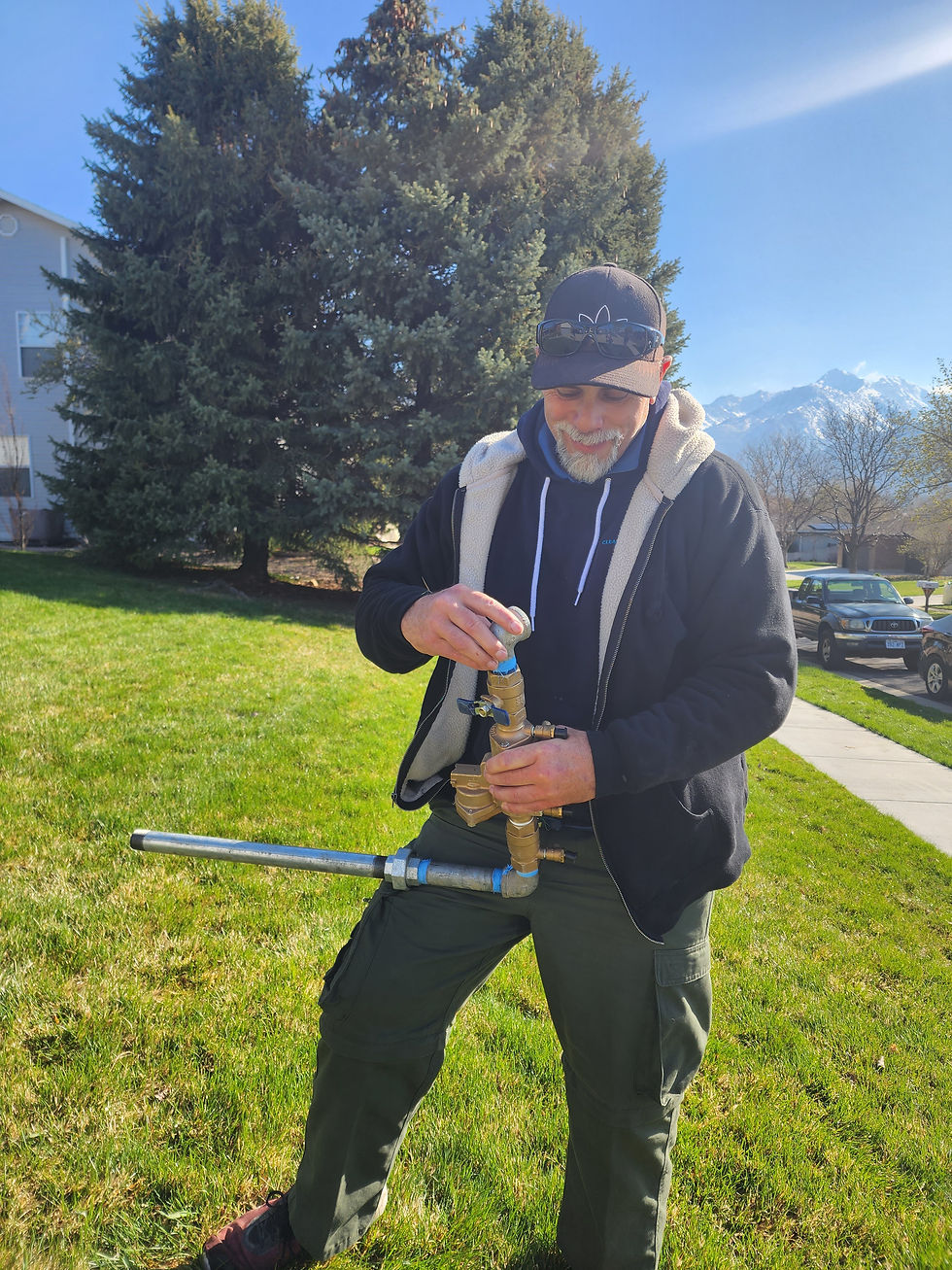 Utah sprinkler professional diagnosing a problem with sprinkler system