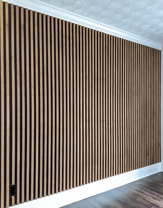 Stained-wood-slat-wall-installed-on-black-wall_LI.jpg.webp