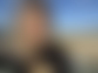 Productivity boost from a change of environment: Designer enjoying creative space by the beach for fresh ideas.