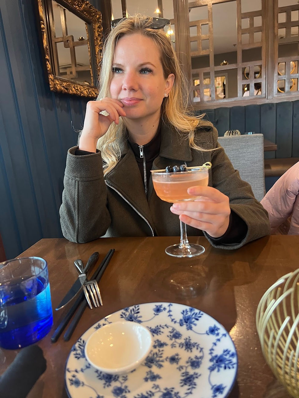 Alexandra Levchuk reflecting during a quiet moment, illustrating creative confidence built through encouragement, clarity, and consistent creative work.