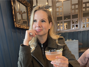 Alexandra Levchuk reflecting during a quiet moment, illustrating creative confidence built through encouragement, clarity, and consistent creative work