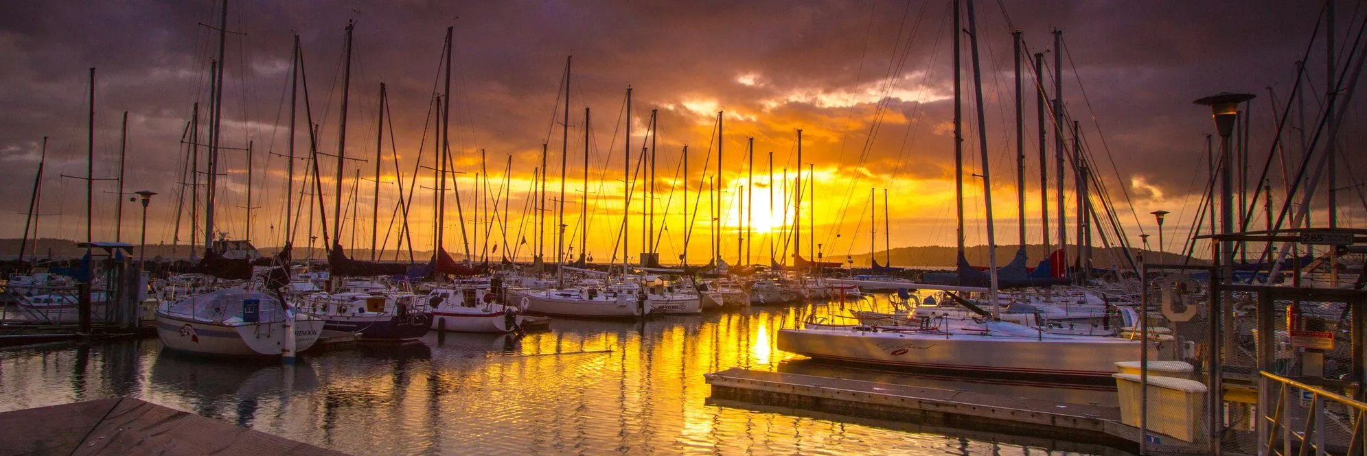 Sunset over sailboats at the Des Moines Marina, Waterland City