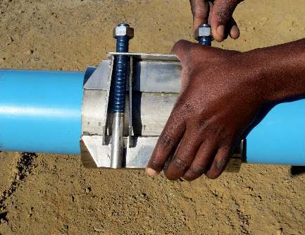 Squeeze the lugs together so that the nuts can be spun down the studs.