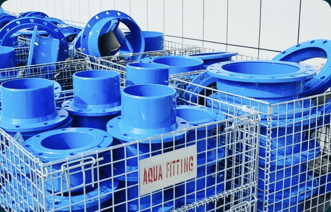 AQUAFITTING coated flanged components in factory storage baskets