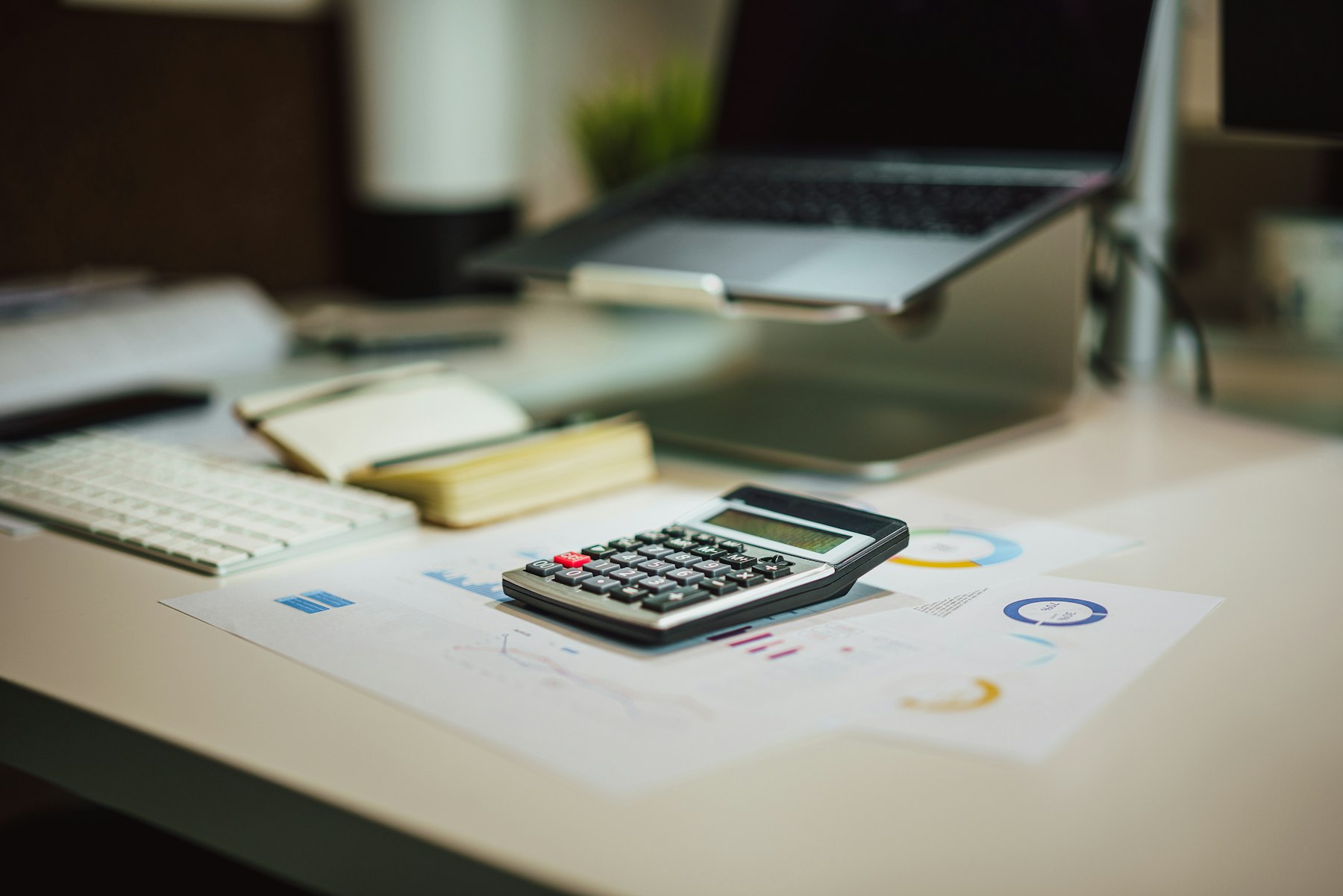 Calculator next to laptop