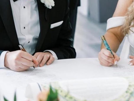 wedding vow signing close-up pen