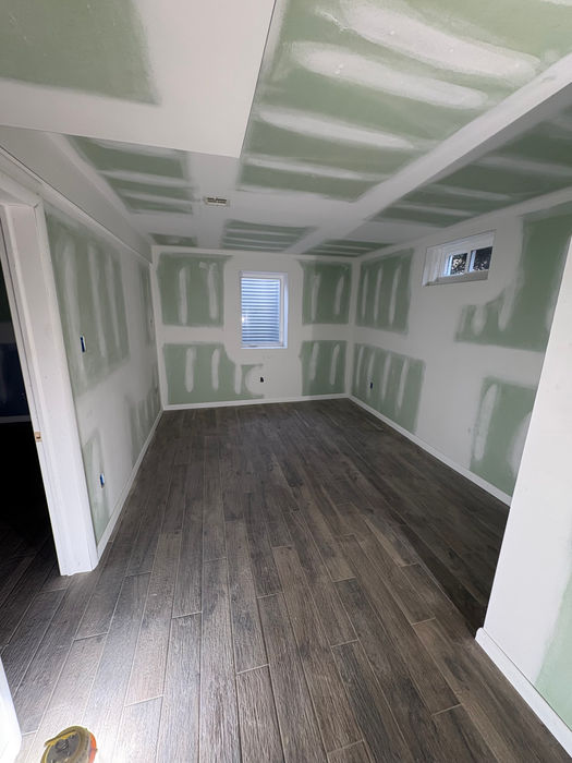 Sheetrocked Windows Doors and Flooring of a Basement Remodel in Mountainside NJ by Promar Builders