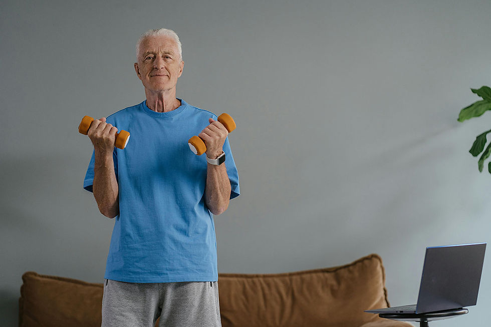 Elderly man working out with dumbells