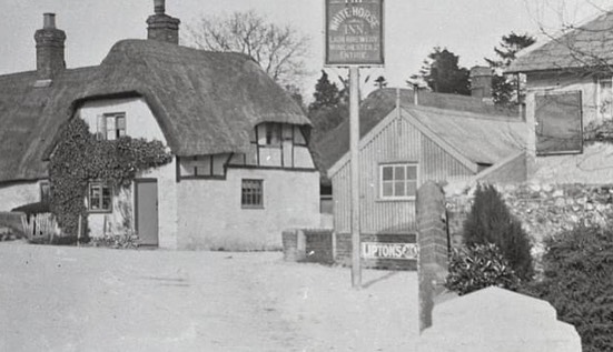 The White Horse Inn & Crtossroads Cottage. Note the "Navvy Hut" in the front garden of WHC!