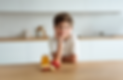 rdesigns_A_young_boy_smiles_with_apple_slices_on_the_kitchen_ta_d19003c9-a5d3-4916-b272-21