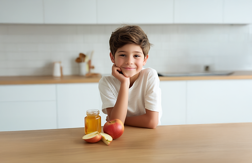 rdesigns_A_young_boy_smiles_with_apple_slices_on_the_kitchen_ta_d19003c9-a5d3-4916-b272-21