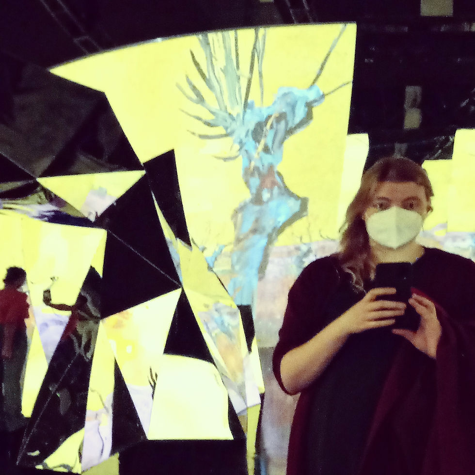 The photo is of me at 26 at an interactive art exhibition in the middle of my New York era, which entailed consuming large amounts of art despite coinciding with the pandemic.
