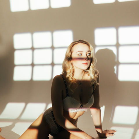 girl with window lights glowing on her