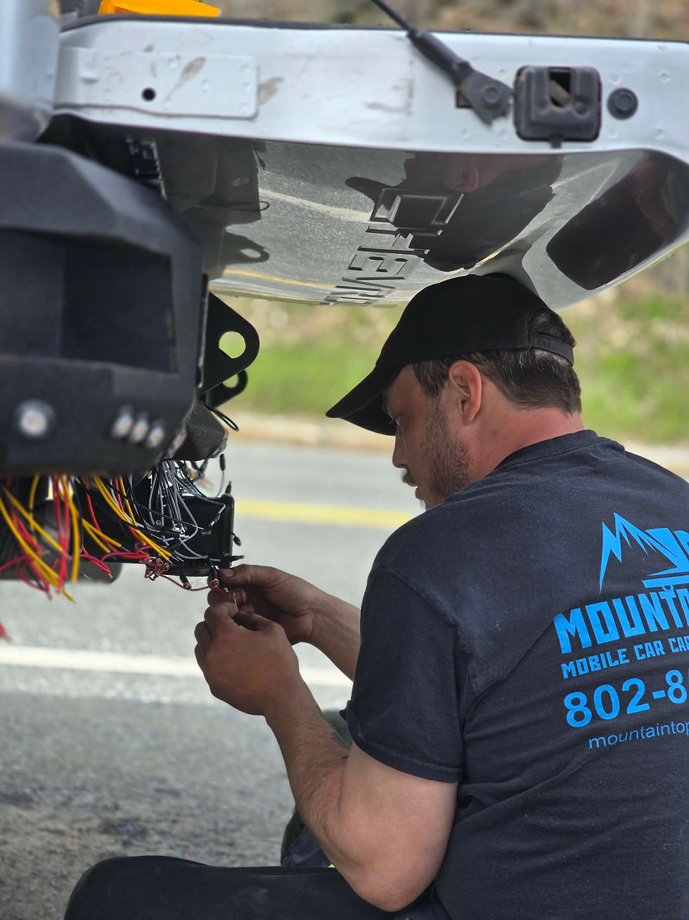 Nic, the owner, setting up extra light wiring for Mountaintop Mobile.