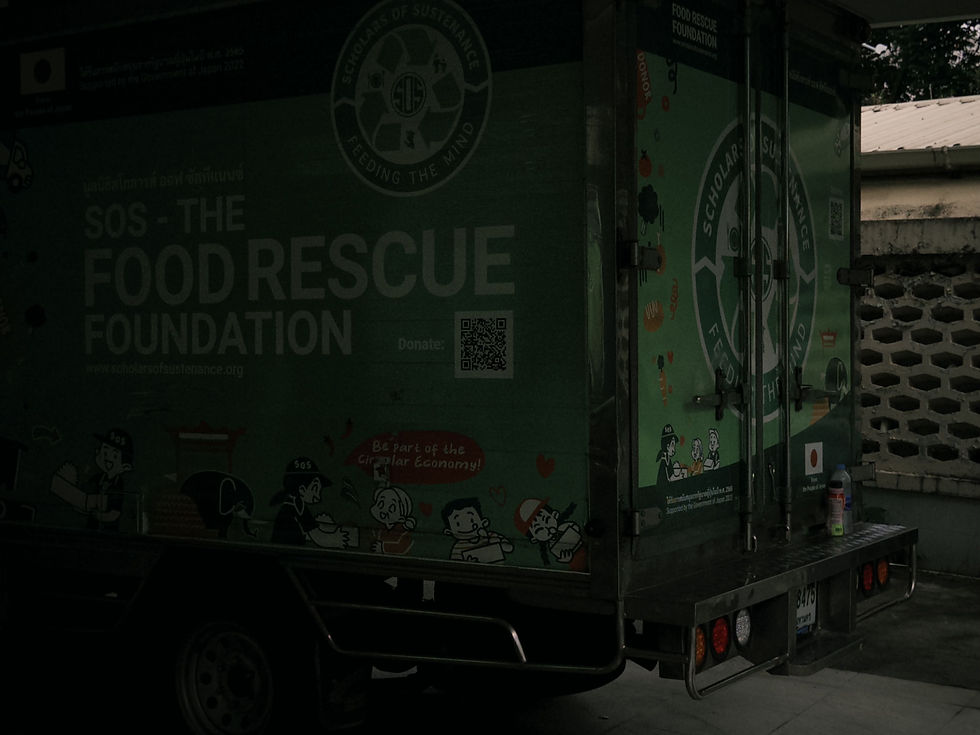 dark green food rescue foundation truck with illustrated graphics, landscape