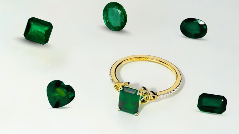 Emerald ring with intricate gold detailing with beautiful emerald loose stones