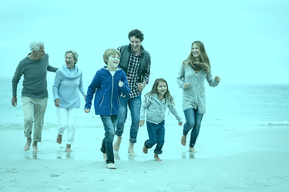 Full length of happy multi-generation family running at sea shore against sky_edited.jpg