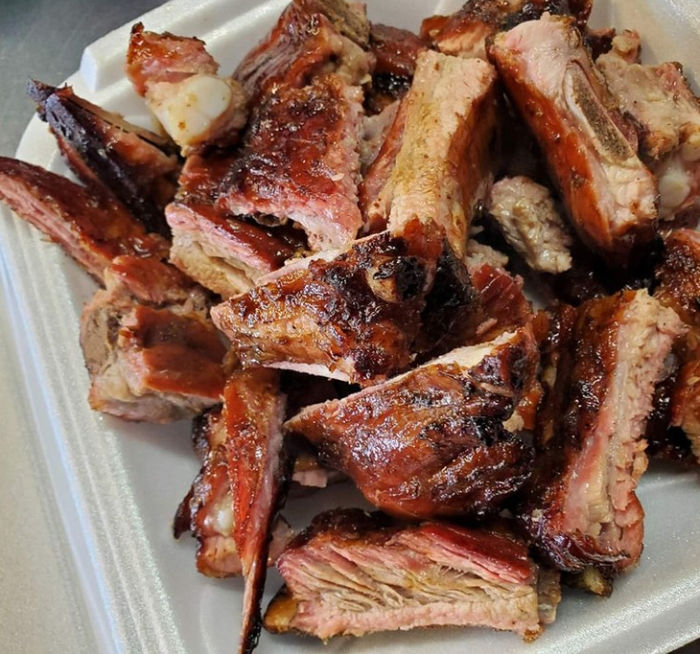 A container full of chopped pork.