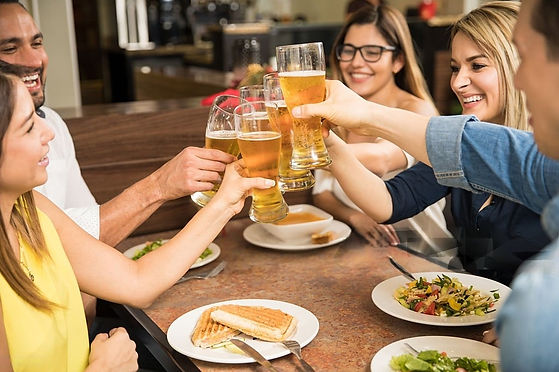 PeopleEnjoyingABeerAndFood-transformed.jpeg