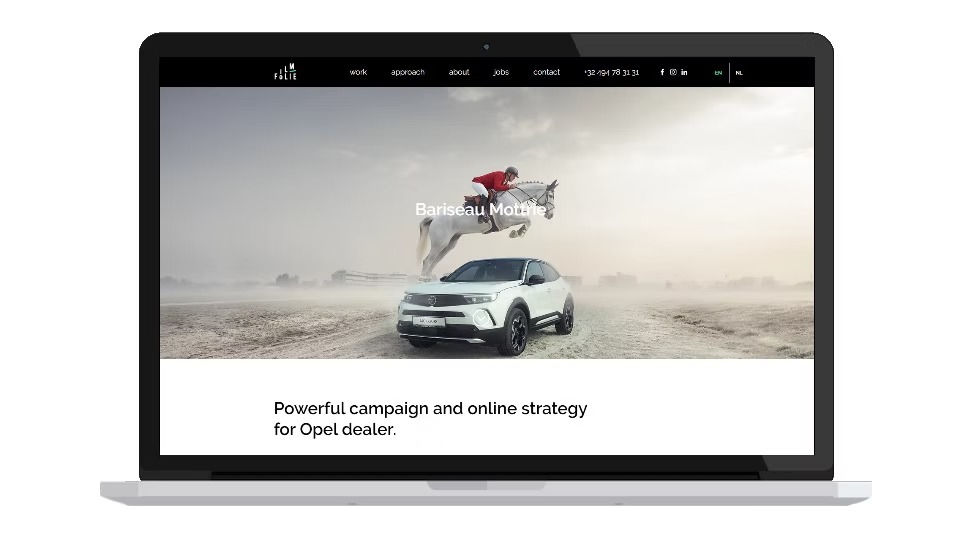 Laptop screen displaying a website with a white car and a horse jumping over it in a desert. Text: Powerful campaign for Opel dealer.