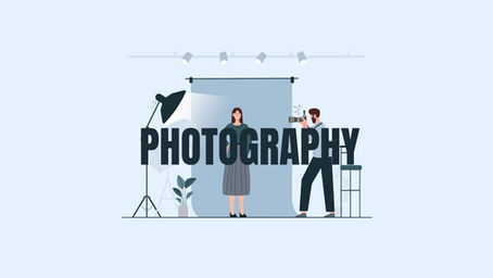 Display showing a photography scene with a photographer and a model. Large "PHOTOGRAPHY" text. Studio lights and backdrop are visible.