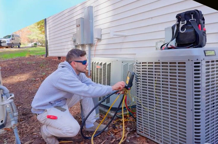 Cory servicing an outdoor unit