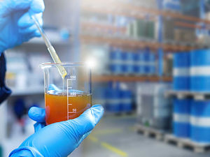 Scientist testing oil sample in lab