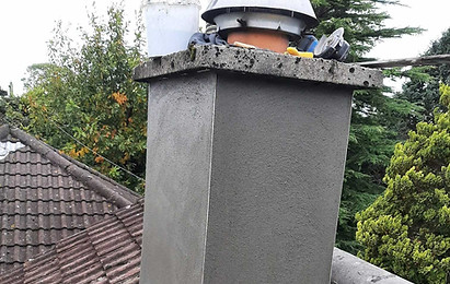 Chimney repair: newly rendered chimney stack