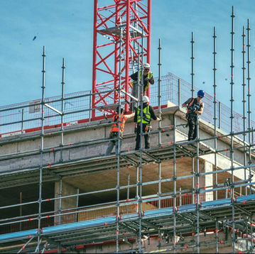Workers on scaffolding during building construction