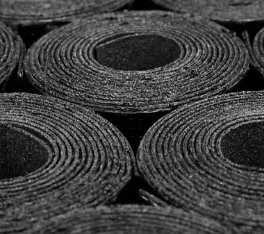 Close-up view of rolled felt roofing material ready for application