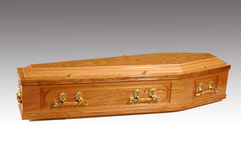 Oak coffin with brass handles