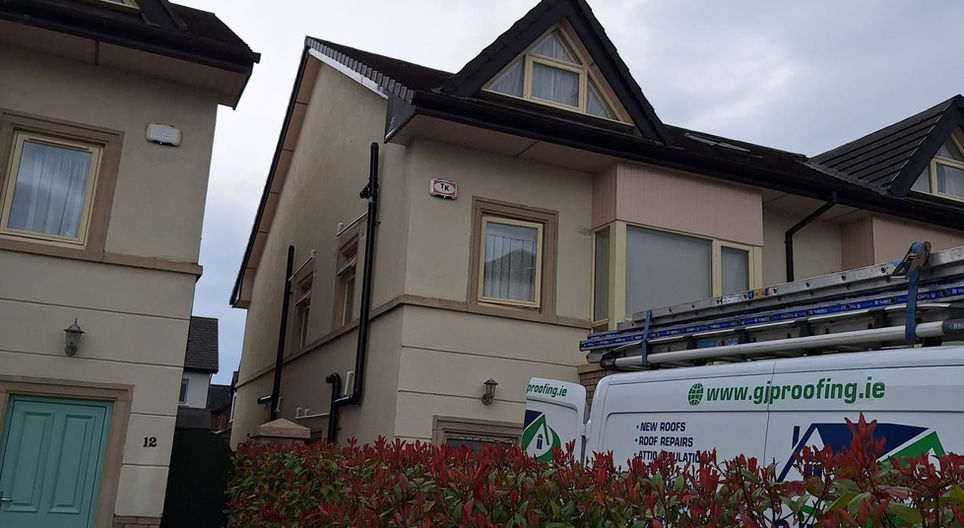 Exterior of a building with visible roof, FASCIA, SOFFITS & GUTTERS, and windows.
