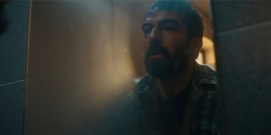 Man looking through a door, Eoghan Hand Lighting, dramatic scene in darkness.