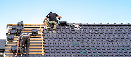 men working on roof