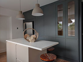 Modern kitchen island with dark cabinets
