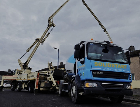 Solidstar concrete pump truck with extended boom arm.