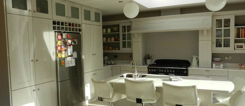 Bright kitchen with island and white cabinets