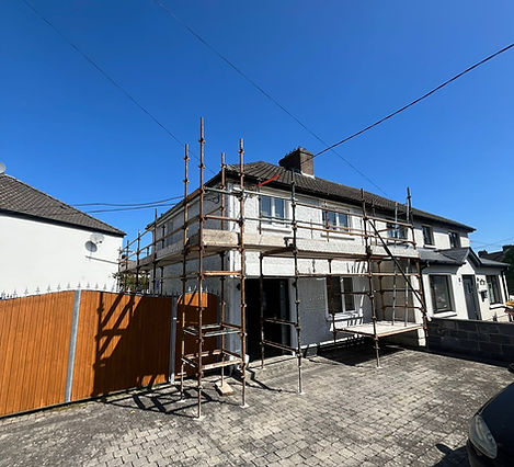 House exterior renovation with scaffolding