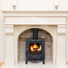 Cozy wood burning stove in fireplace