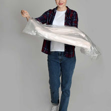 Woman holding vacuum storage bag