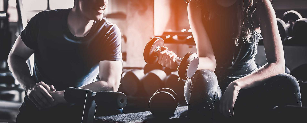 Men and women lifting weights