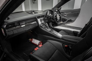 Porsche 911 GT3 interior: black leather seats, fire extinguisher